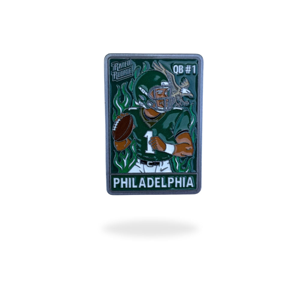 Philadelphia QB #1 ball marker featuring a cartoon football player in midnight-green uniform with flames and eagle-inspired detail – collectible enamel golf ball marker by Pin Creatures.