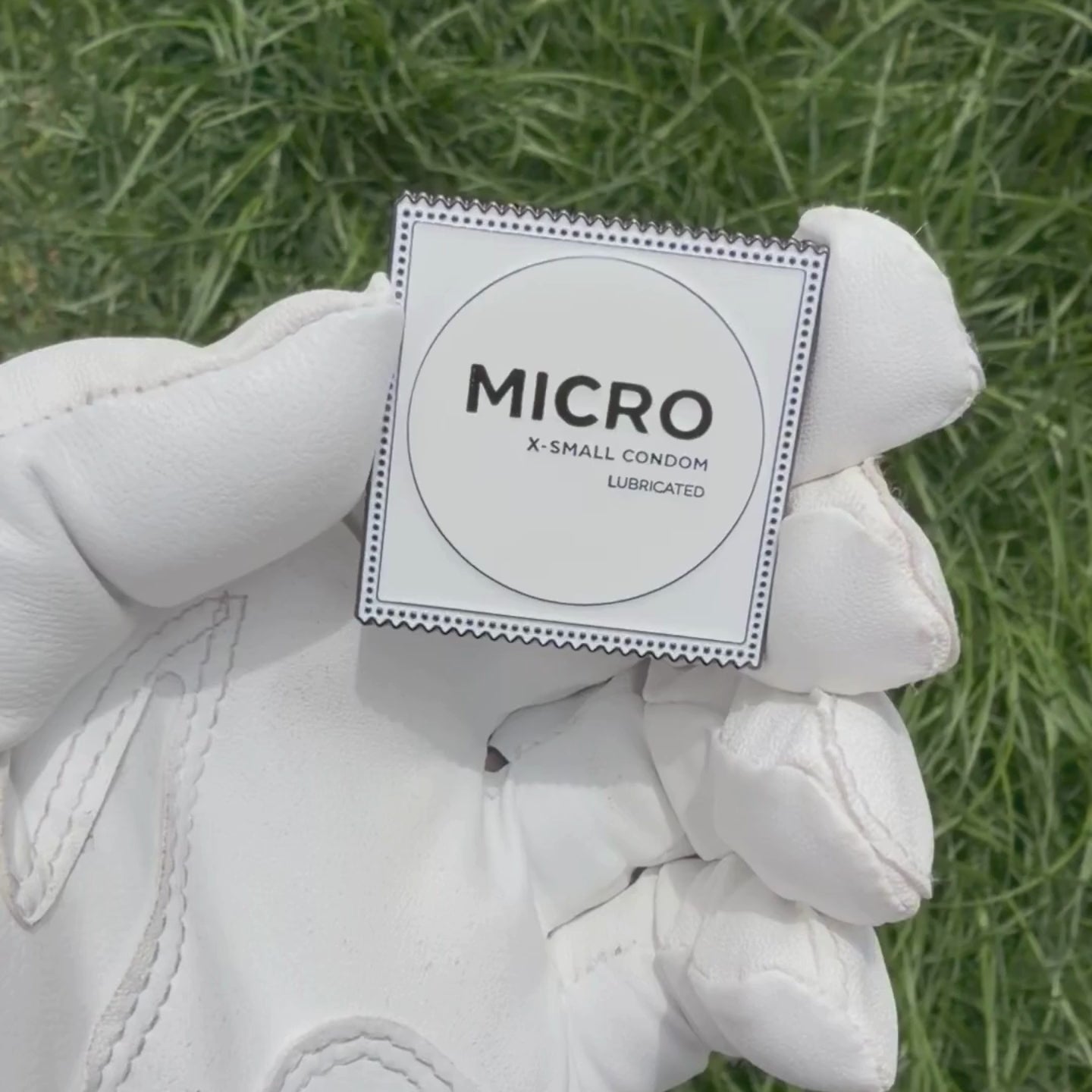 MICRO Condom Golf Ball Marker by Pin Creatures in black nickel soft enamel finish
